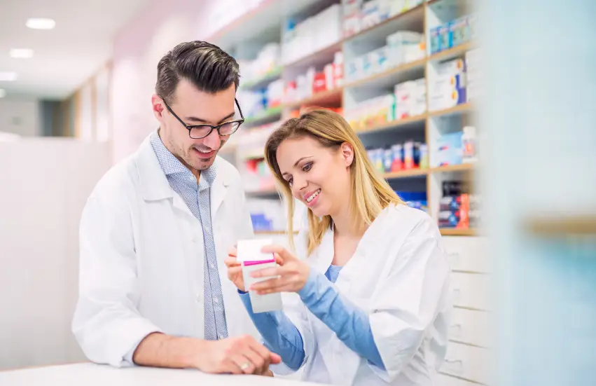 Two pharmacists working in a drugstore.